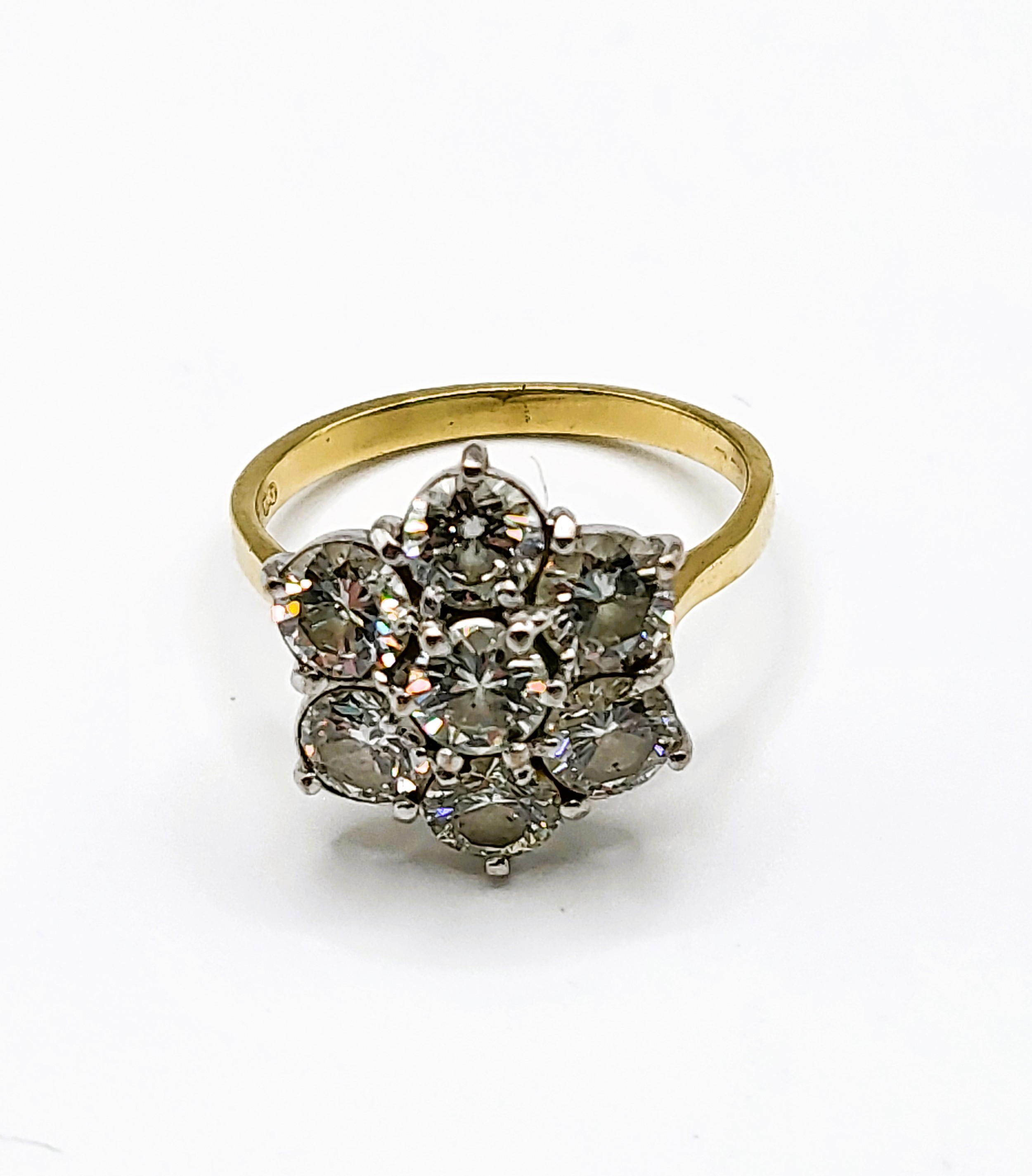 An 18ct yellow gold and diamond floral cluster ring